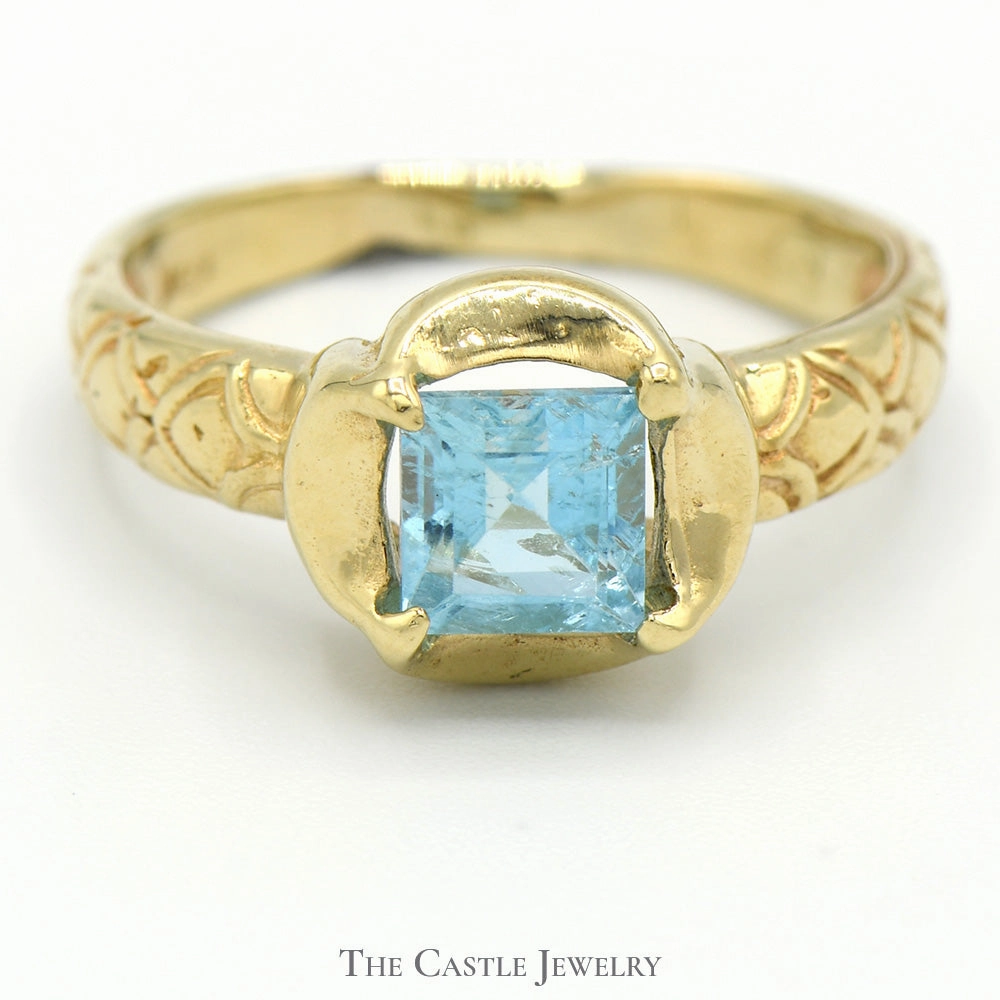 Square Shaped Blue Topaz Ring in 14k Yellow Gold Concave Mounting with Ornate Sides Meaningful Decoration