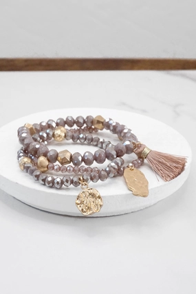 Aristocratic Charm Angelic Amalgamations Beaded bracelet stack with tassel and coins Aqua Taupe Rose