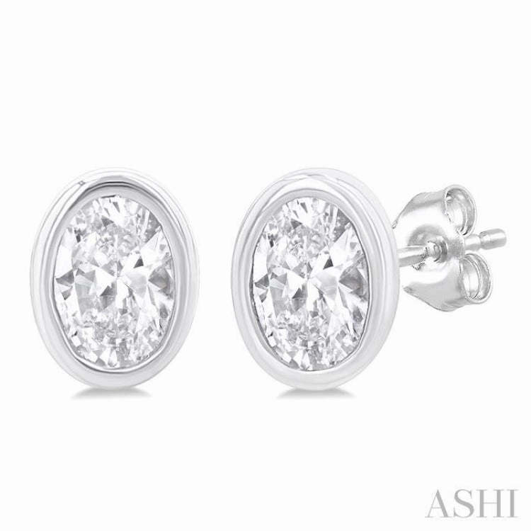 1/5 Ctw Petite Bezel Set Oval Cut Diamond Fashion Stud Earring in 10K White Gold Stunning Finish