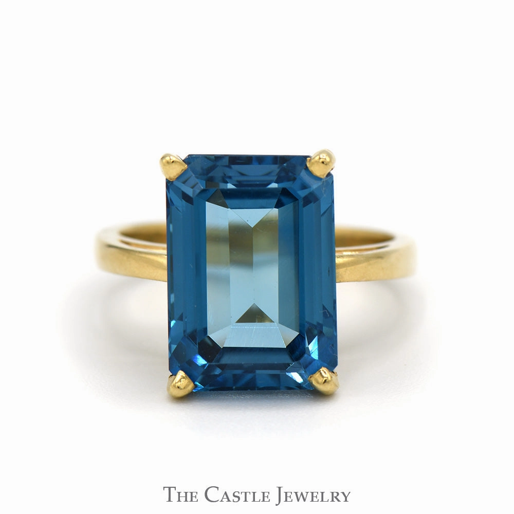 Premium Adornment Emerald Cut Blue Topaz Solitaire Ring in 14k Yellow Gold