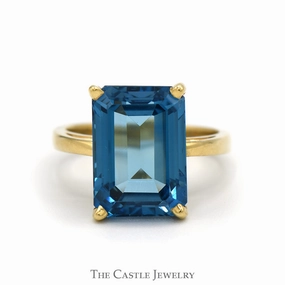 Premium Adornment Emerald Cut Blue Topaz Solitaire Ring in 14k Yellow Gold