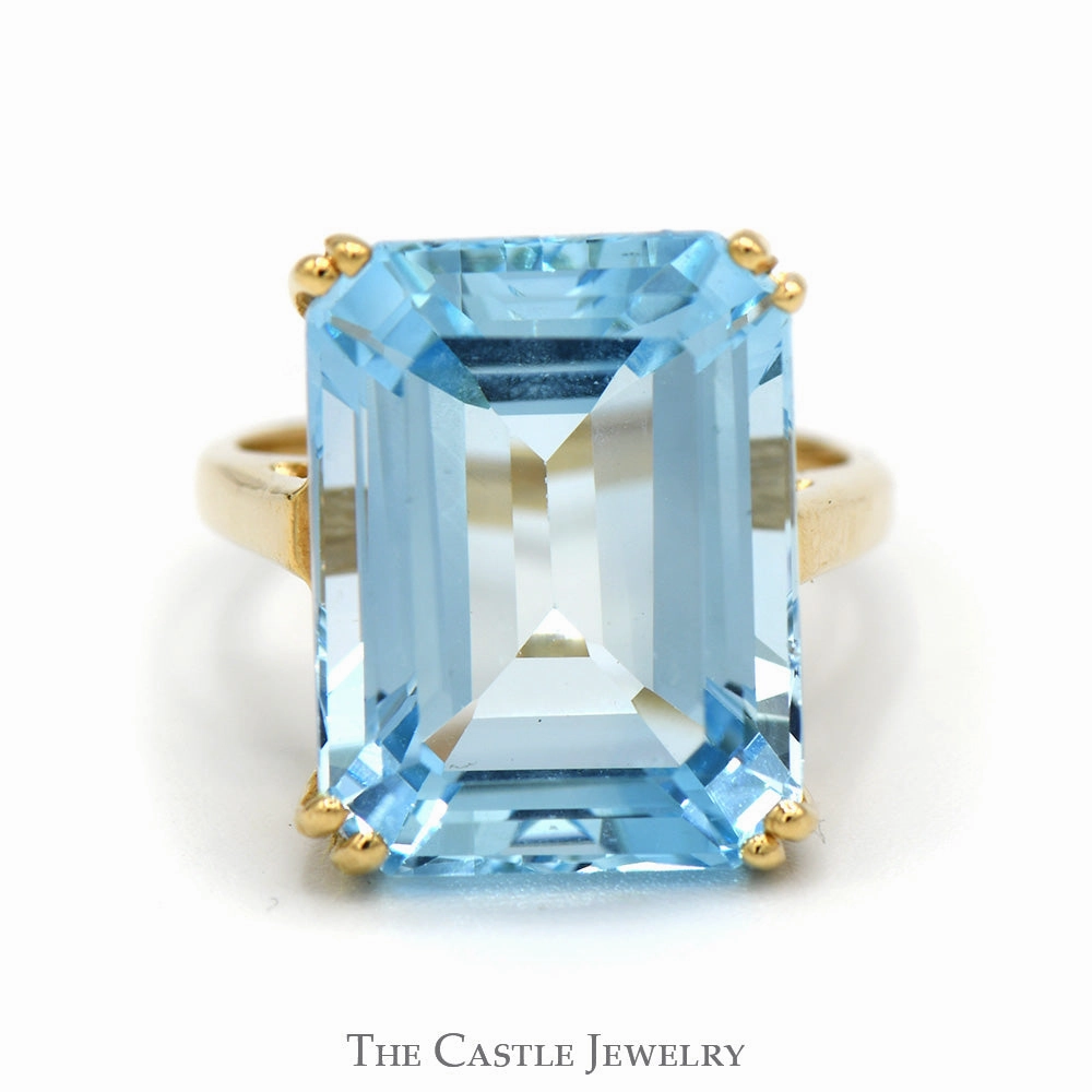 Cultural Fusion Formal Attire Emerald Cut Blue Topaz Ring in 10k Yellow Gold Cathedral Mounting
