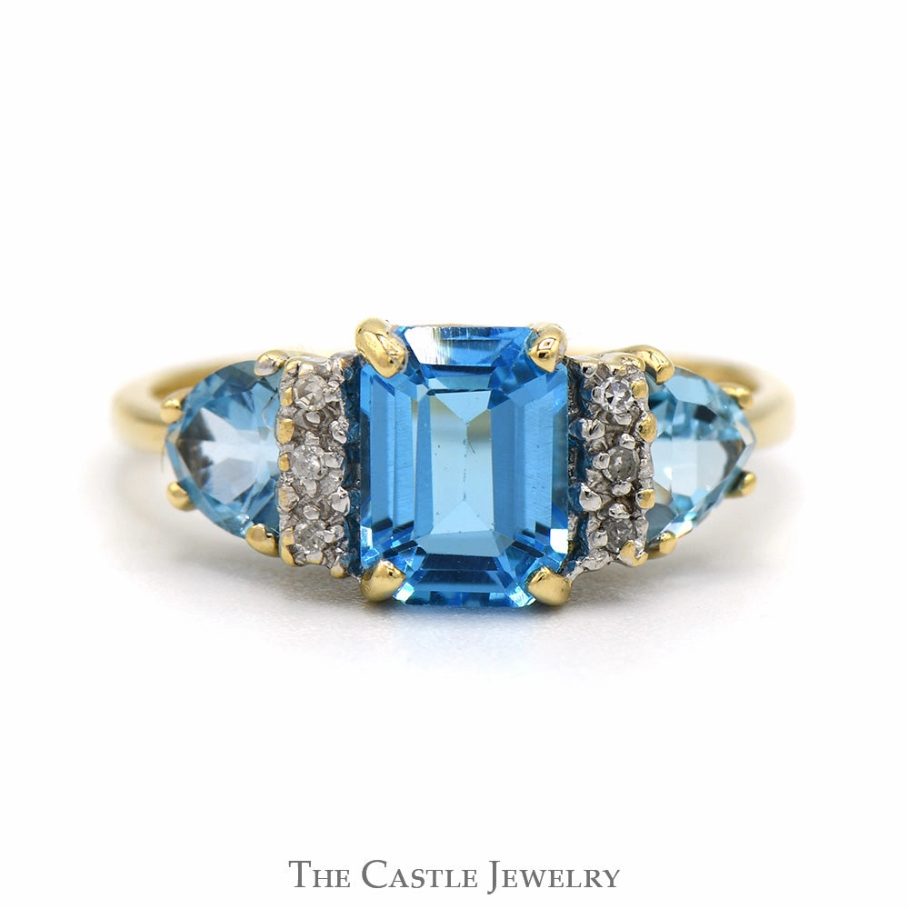 Emerald Cut Blue Topaz Ring with Trillion Cut Sides and Diamond Accents in 10k Yellow Gold Fashionable Statement