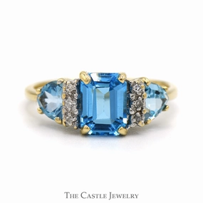 Emerald Cut Blue Topaz Ring with Trillion Cut Sides and Diamond Accents in 10k Yellow Gold Fashionable Statement