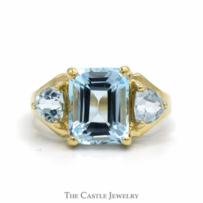 Emerald Cut Blue Topaz Ring with Trillion Cut Topaz Sides in 10k Yellow Gold Glamorous Craft