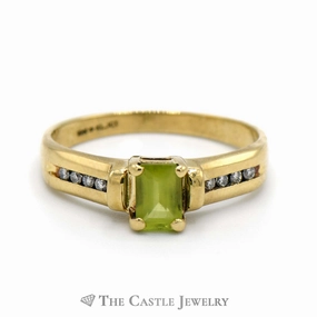 Emerald Cut Peridot Ring with Channel Set Diamond Accented Sides in 10k Yellow Gold Modern Interpretation