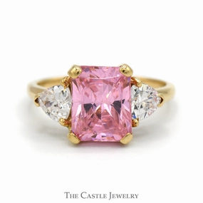 Versatile Jewelry Emerald Cut Pink Ice Ring with Trillion Cut Cubic Zirconia Accents in 10k Yellow Gold