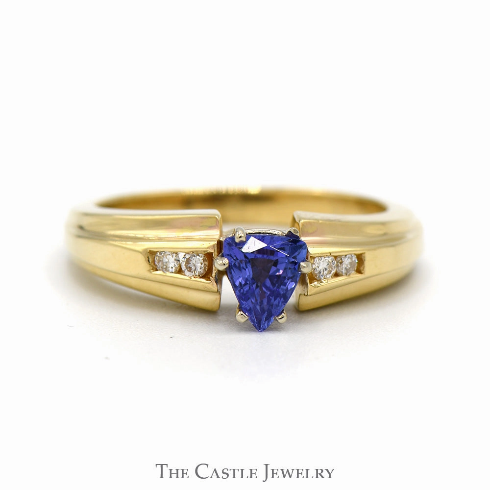 Showcase Piece Trillion Cut Tanzanite Ring with Channel Set Diamond Accents in 14k Yellow Gold