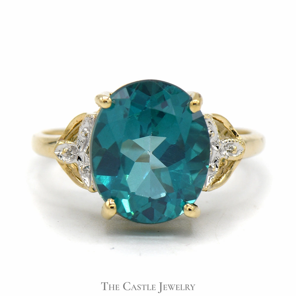 Professional Grade Oval Blue Nile Topaz Ring with Illusion Set Diamond Accents in 10k Yellow Gold