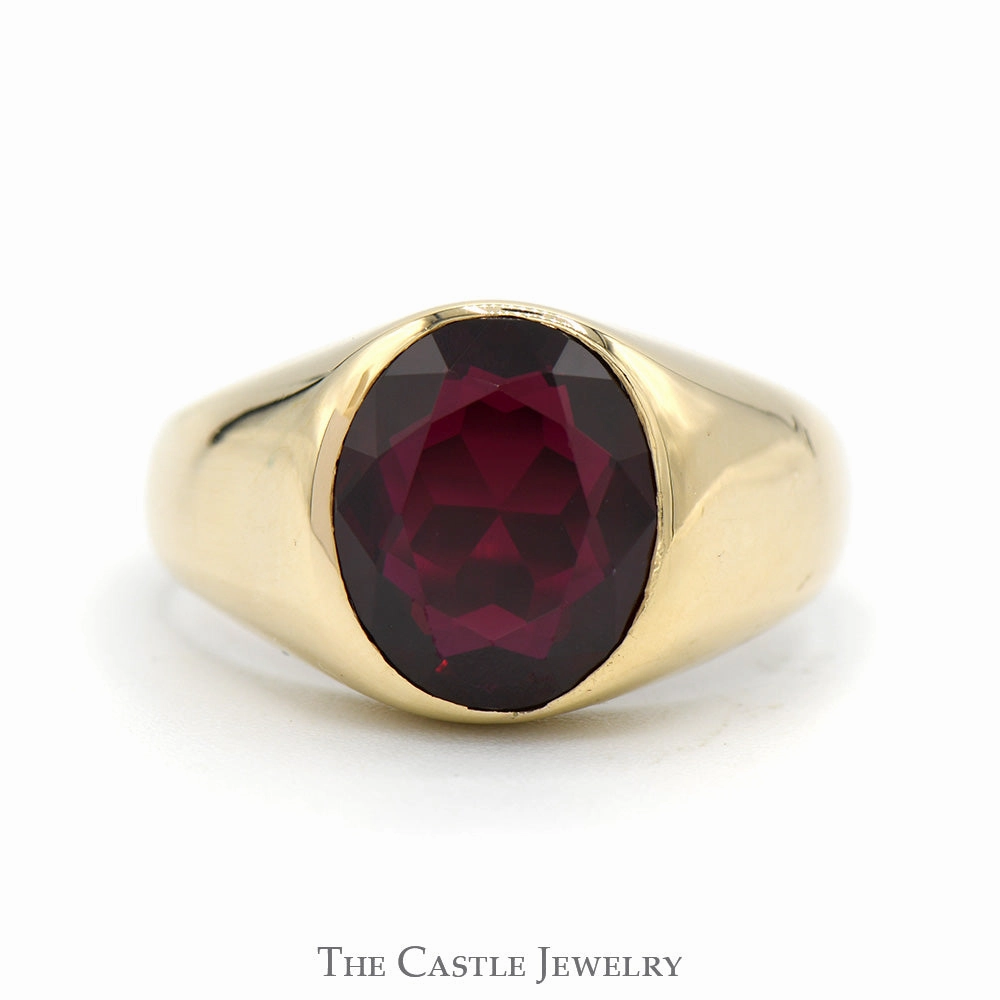 Value Article Bezel Set Oval Garnet Ring with Polished Sides in 10k Yellow Gold