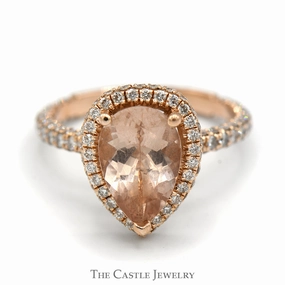 Chic Symbol Dress Down Pear Cut Morganite Ring with Diamond Halo and Accented Sides in 14k Rose Gold