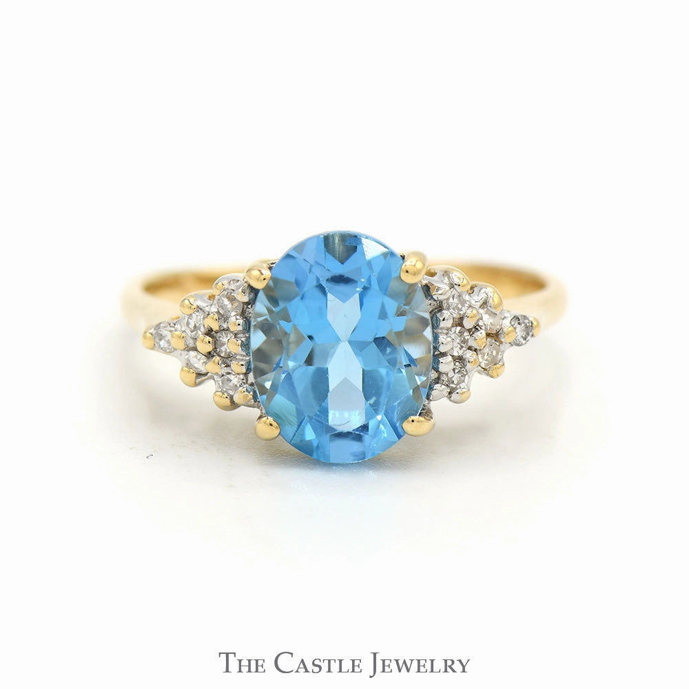 Oval Cut Blue Topaz Ring with Diamond Cluster Accented Sides in 14k Yellow Gold Classic Keepsake