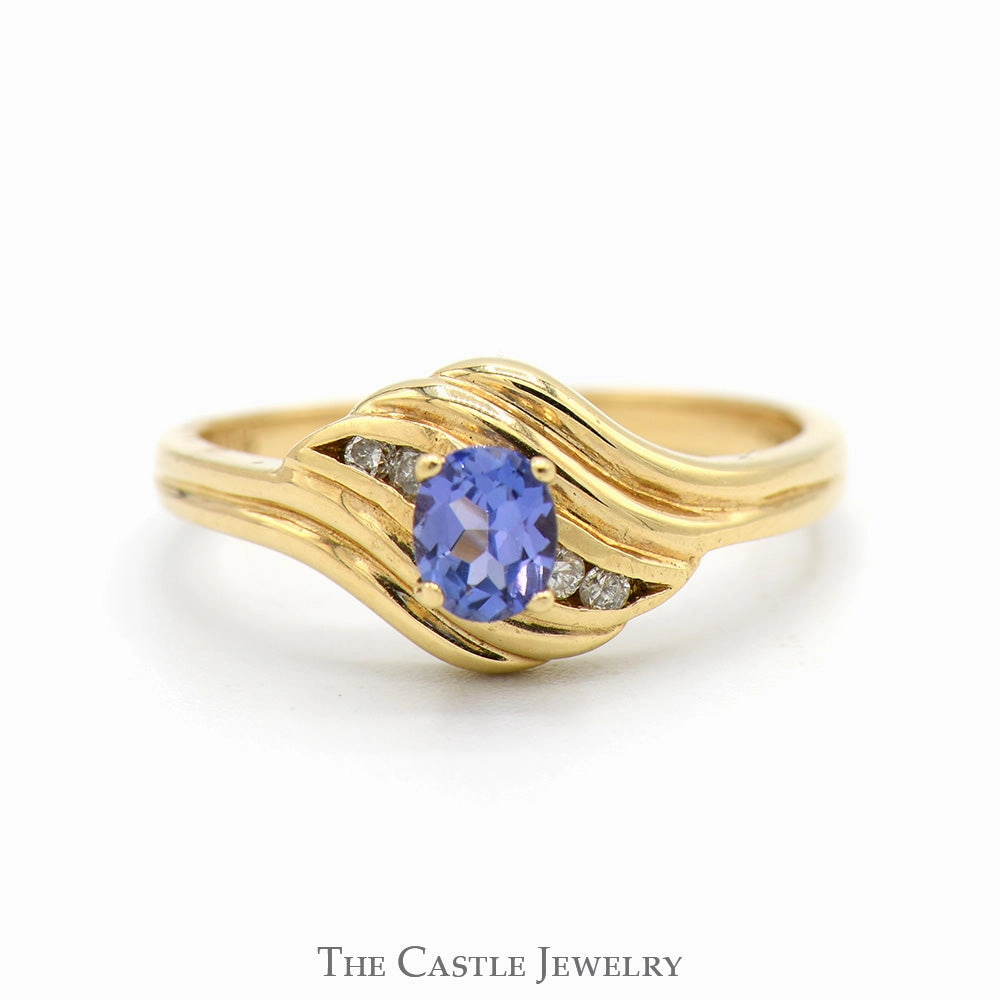 Oval Tanzanite Ring with Diamond Accented Sides in 14k Yellow Gold Classic Token