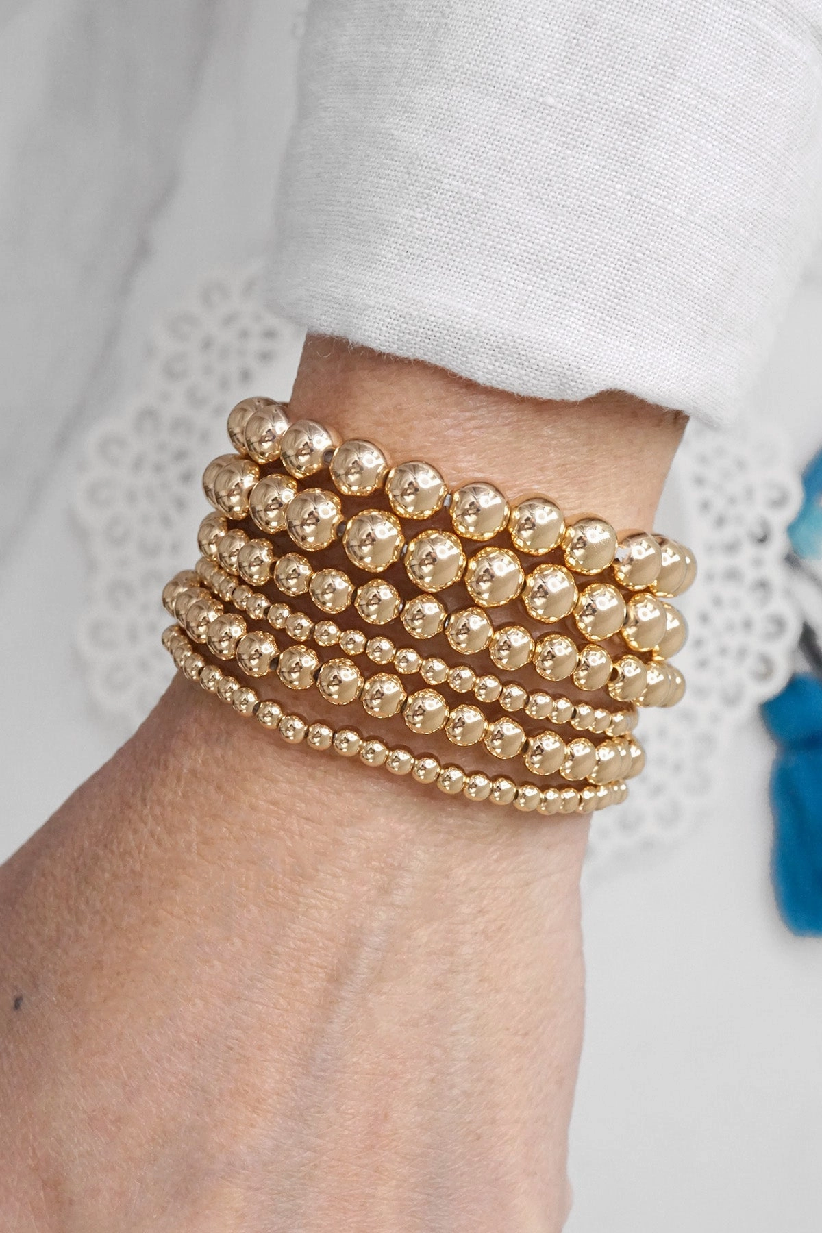 Charming Feature Multi size ball beaded bracelet stack gold tone bracelets