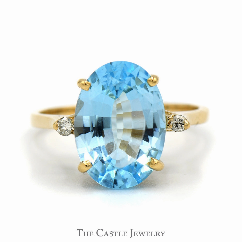 Balanced Finish Oval Blue Topaz Ring with Diamond Accents in 10k Yellow Gold