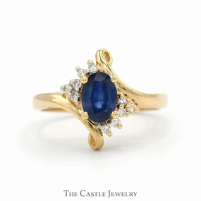 Oval Cut Sapphire Ring with Diamond Accents in 14k Yellow Gold Bypass Mounting Artistic Work