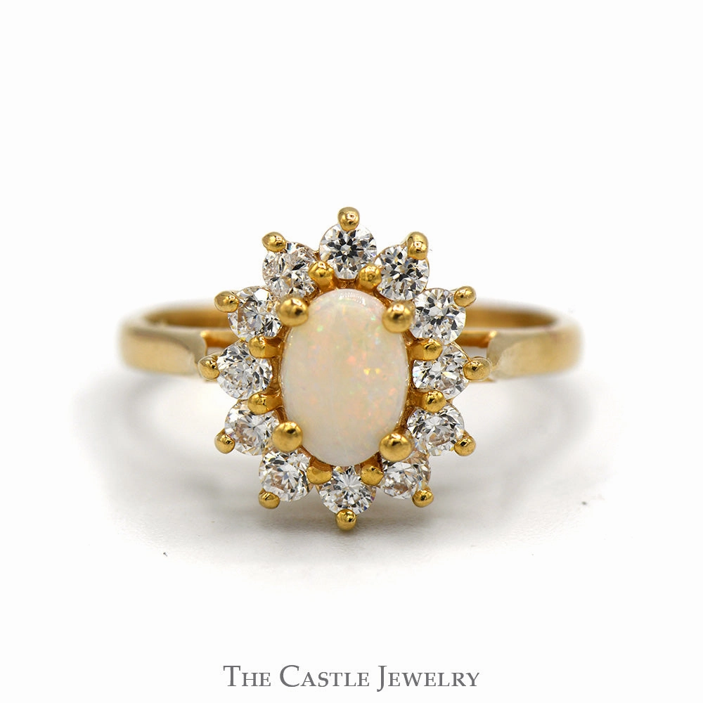 Synthetic Make Oval Opal Ring with Cubic Zirconia Halo in 14k Yellow Gold