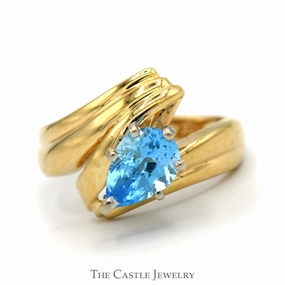 Premium Ornament Pear Cut Blue Topaz Ring with Ridged Bypass Sides in 14k Yellow Gold