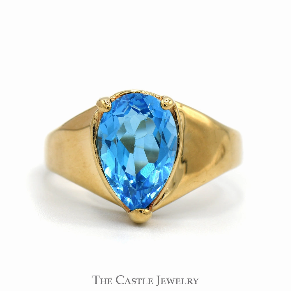 Monochrome Style Classic Ornament Pear Cut Blue Topaz Ring with Tapered Band in 10k Yellow Gold