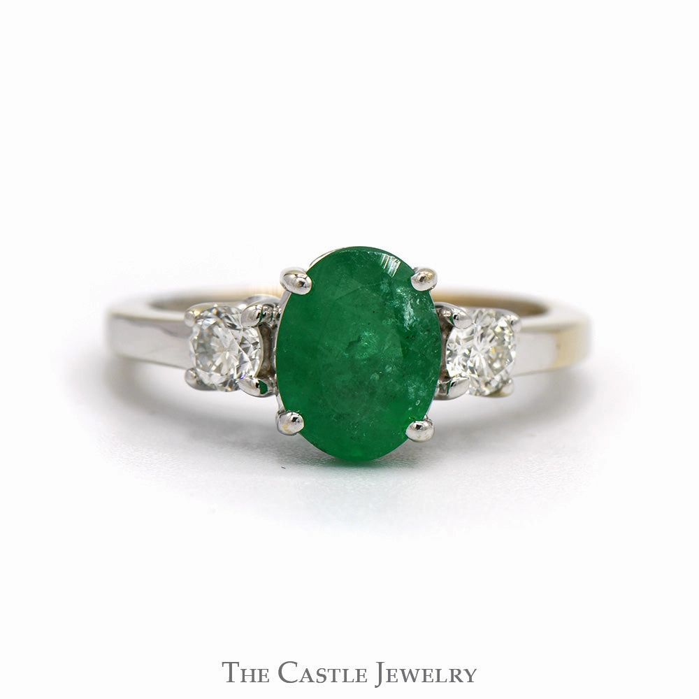 Quality Article Oval Cut Emerald Ring with Diamond Accented Sides in 18k White Gold