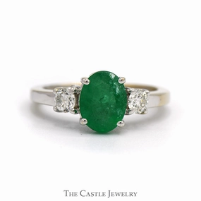 Quality Article Oval Cut Emerald Ring with Diamond Accented Sides in 18k White Gold