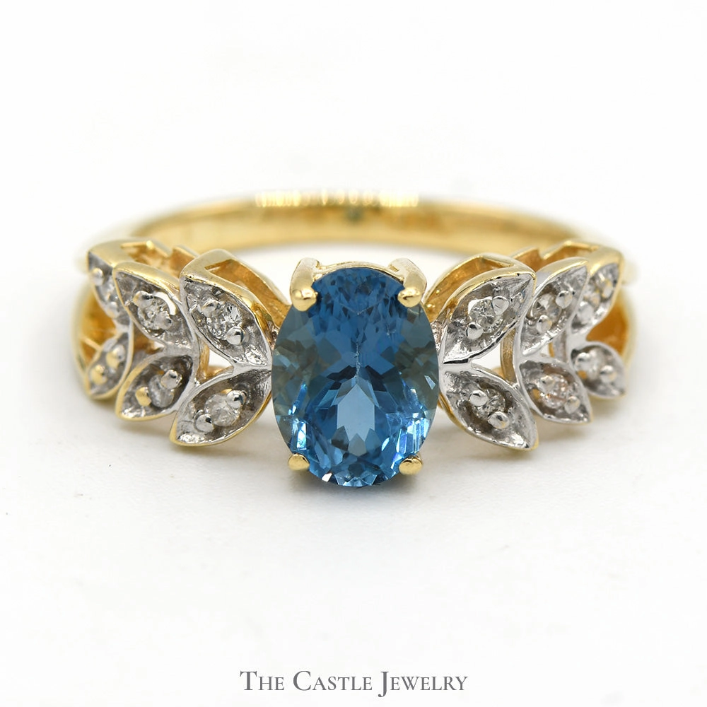 Oval Blue Topaz Ring with Diamond Accented Leaf Design in 14k Yellow Gold Understated Glimmer Luxury Adornment