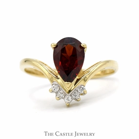 Sturdy Symbol Convenient Care Pear Cut Garnet Ring with Diamond Accents in 14k Yellow Gold "V" Shaped Setting