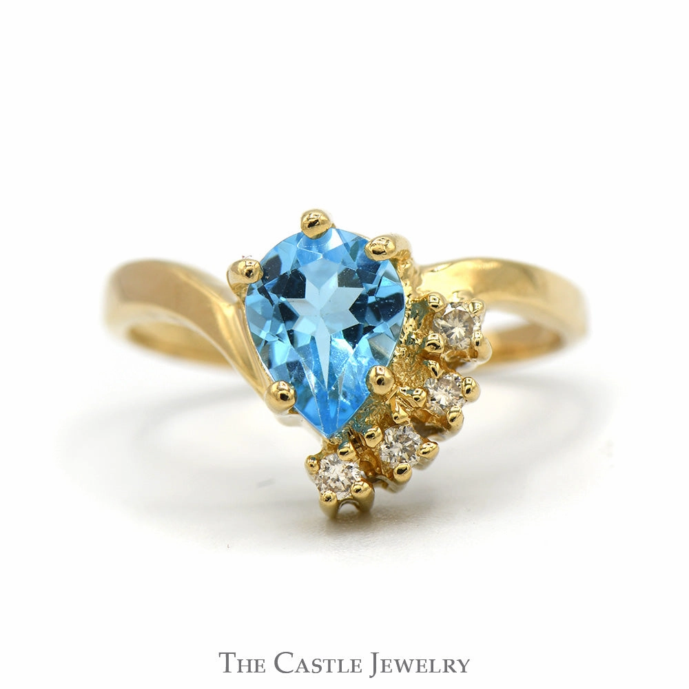 Amazing Adornment Pear Cut Blue Topaz Ring with Diamond Accents in 14k Yellow Gold