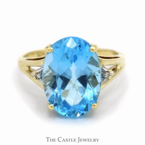 Oval Blue Topaz Ring with Diamond Accents in 10k Yellow Gold Split Shank Setting Modern Wear