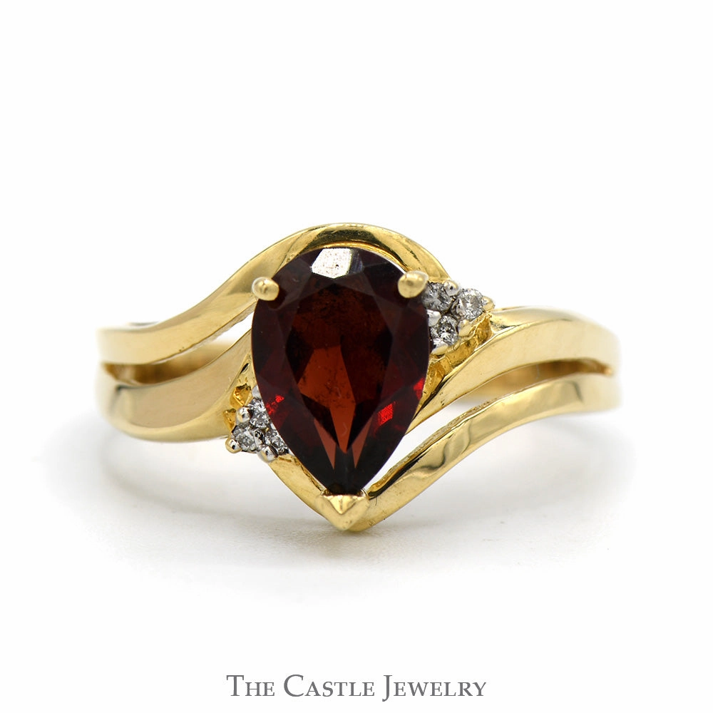Solid Construction Soft Edge Pear Cut Garnet Ring with Illusion Set Diamond Accents in 10k Yellow Gold