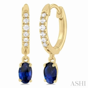 Radiant Edge 5x3 MM Oval Cut Sapphire and 1/8 Ctw Petite Round Cut Diamond Precious Fashion Huggies in 10K Yellow Gold