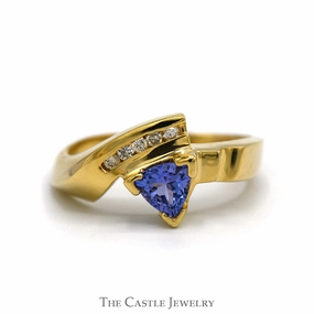 Balanced Form Trillion Cut Tanzanite Ring with Channel Set Diamond Accents in 14k Yellow Gold Bypass Mounting
