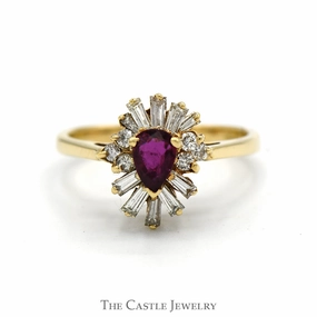 standalone piece Pear Cut Ruby Ring with Baguette and Round Diamond Halo in 14k Yellow Gold